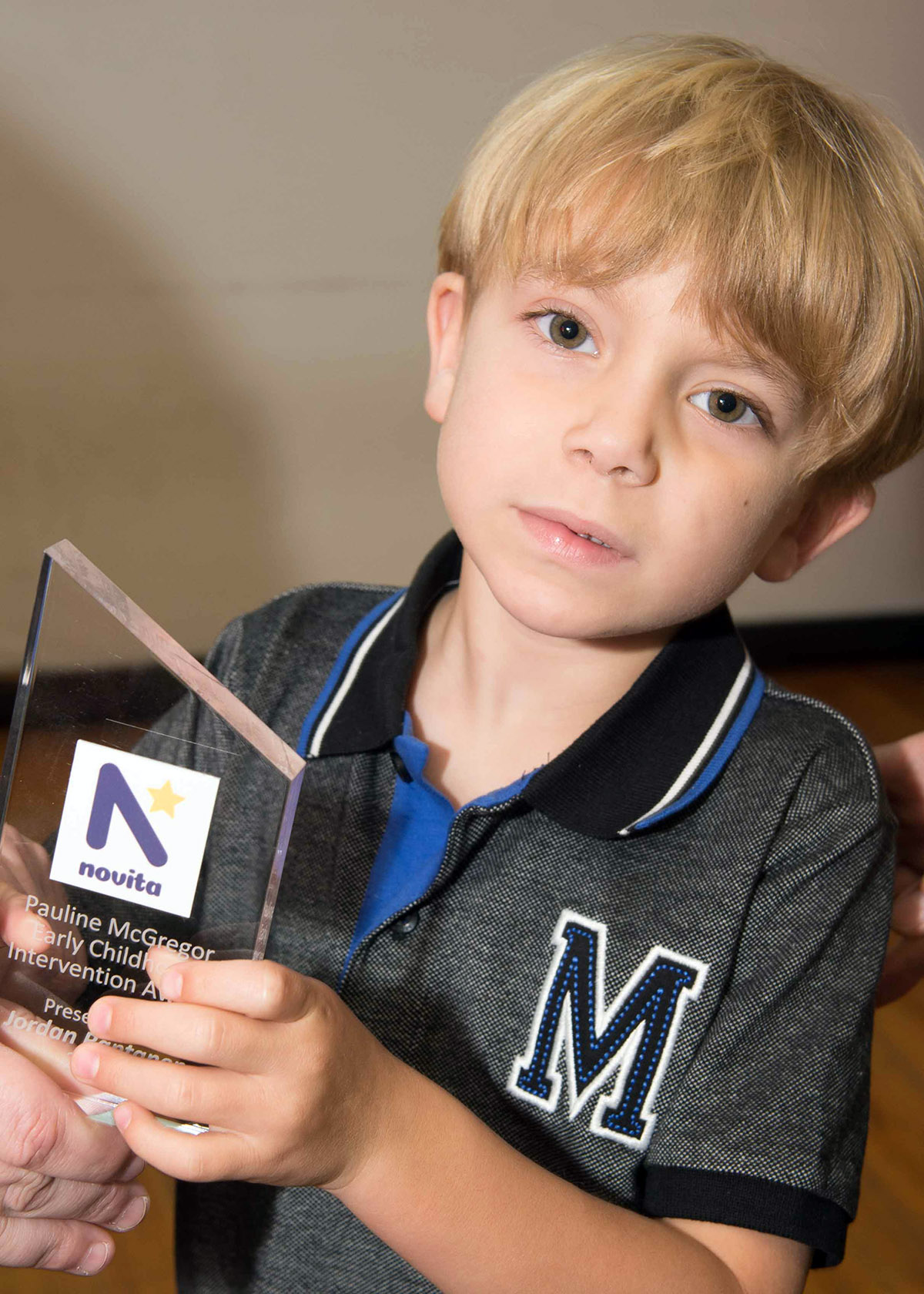 Jordan holding his award