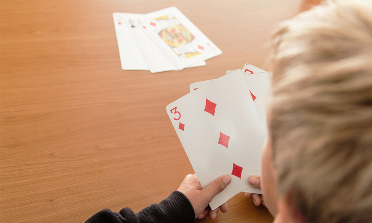 Boy playing Go Fish