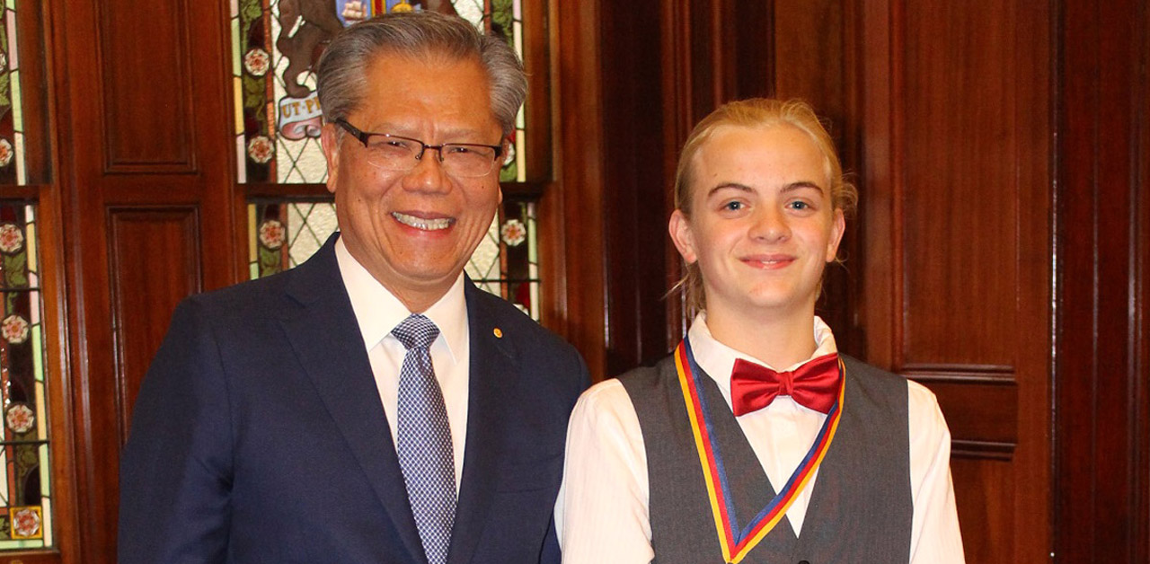 Kyle receiving his award from the Honourable Hieu Van Le, Governor of SA.